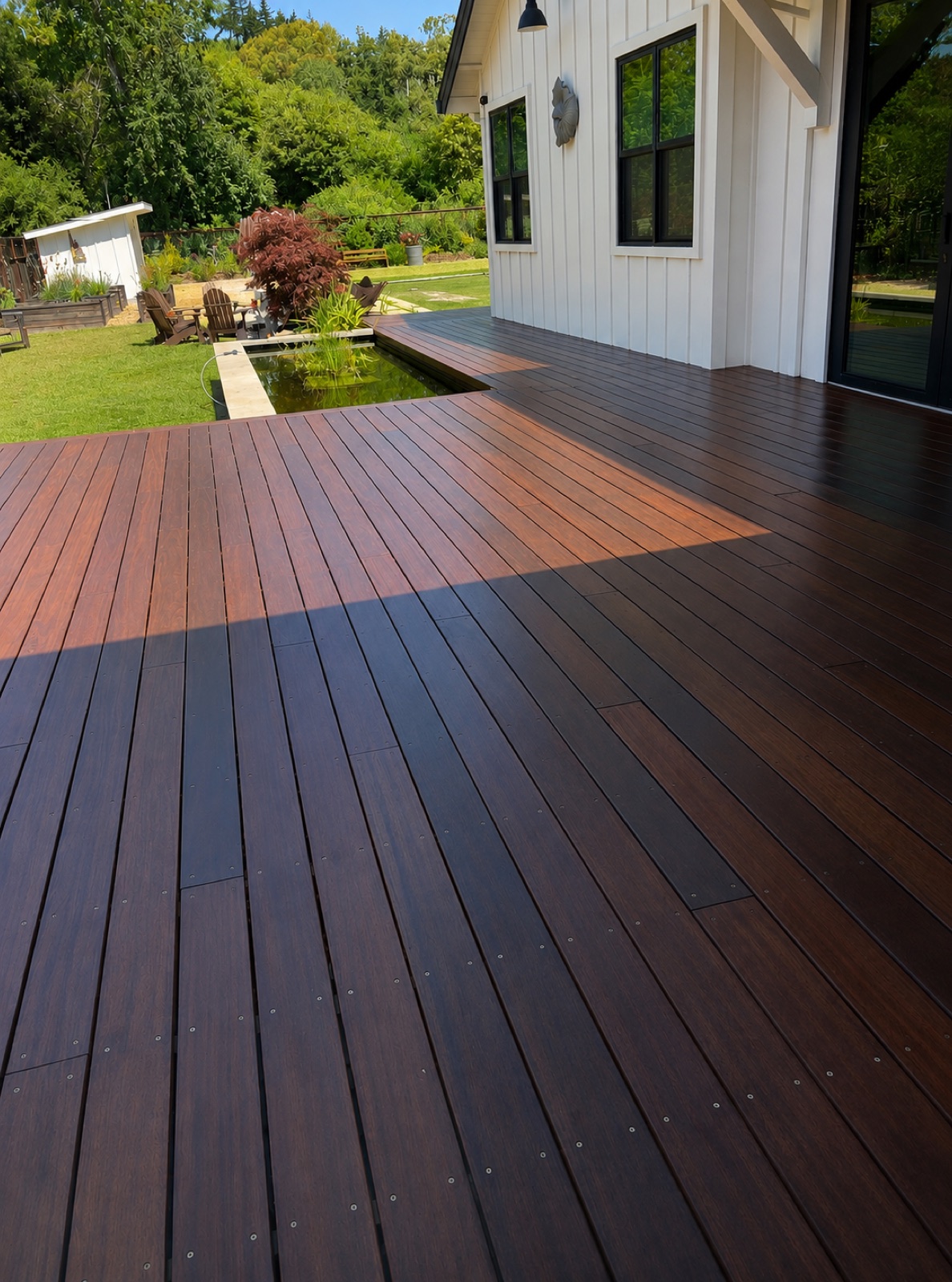 Ipe deck wrapping the rear of a farmhouse rebuilt after the 2017 Tubbs Fire